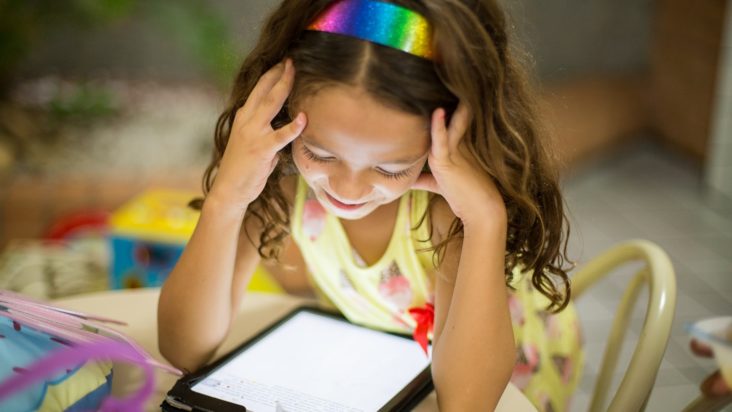 Girl playing with iPad
