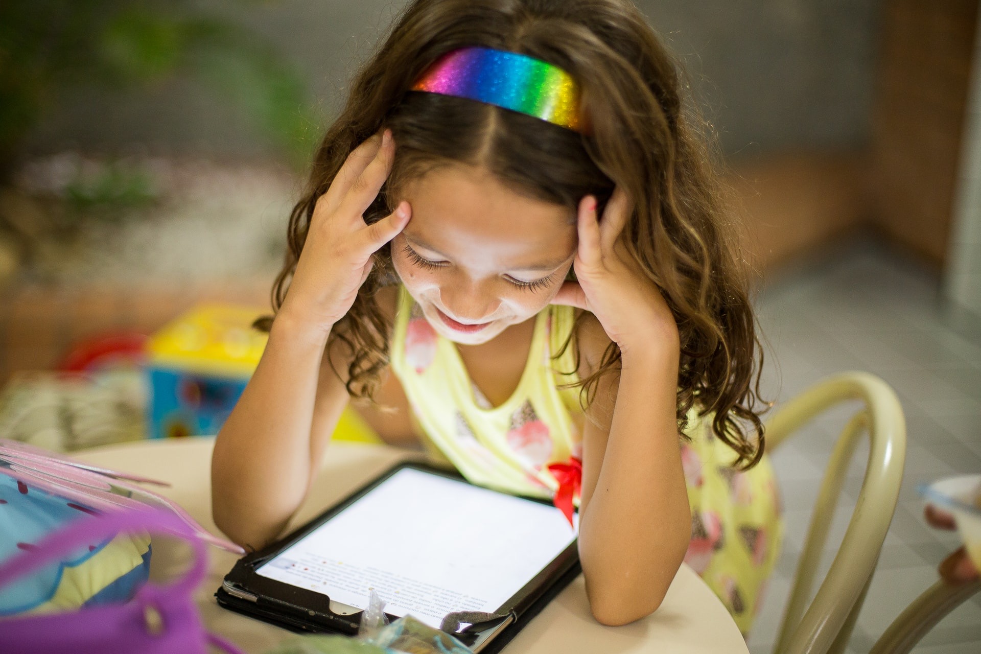 Girl playing with iPad