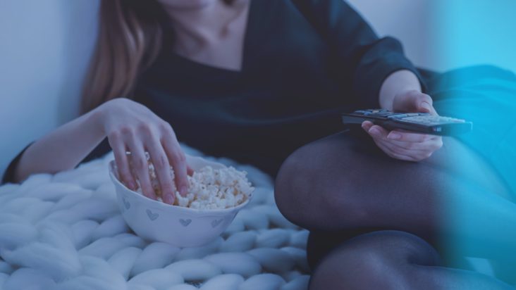 A woman enjoying a movie