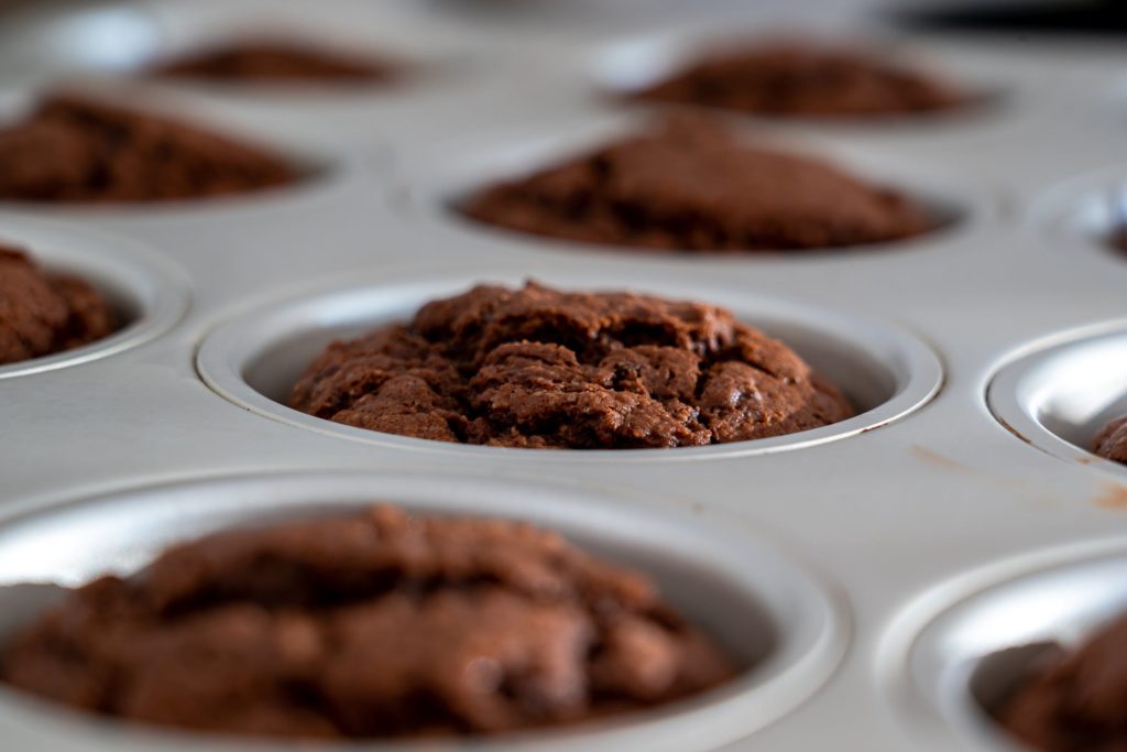 Freshly-baked muffins with cacao nibs