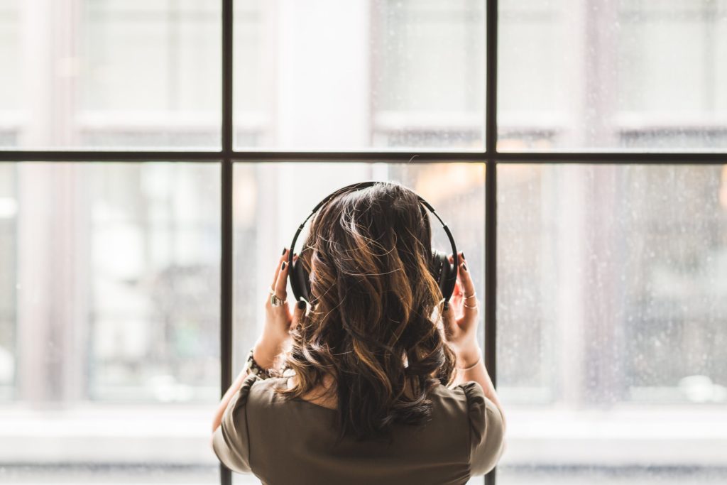 A photo of a woman listening to music